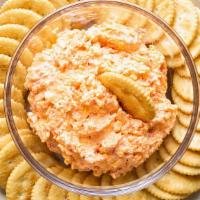 Pimento Cheese Dip · Sharp cheddar, pimentos, house pickles Served with crackers & celery