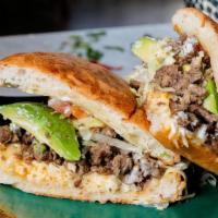 Steak Torta · Served with lettuce, tomato, avocado, beans, cheese, sour cream and Steak.
