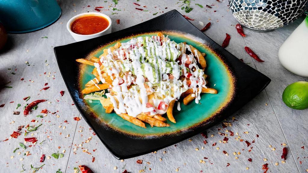 Mexicans French Fries Supreme · Lettuce,Tomato,Guacamole, Soure Cream,Nacho Cheese with hint of queso fresco(Chicake, Steak or Grounbeef- ADD $1)