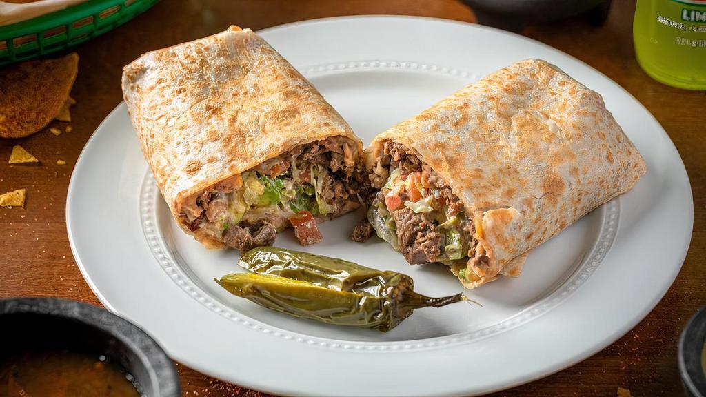 Steak Burrito · Served with lettuce, tomato, avocado, beans, cheese, sour cream and Steak.