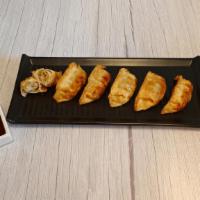 Chicken Dumplings · Six Crispy Chicken Dumplings paired with Ponzu Chili Dipping Sauce