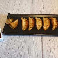Pork Dumplings · Six Crispy Pork Dumplings paired with Ponzu Chili Dipping Sauce