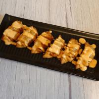 Sriracha Aioli Pork Dumplings · Six Crispy Pork Dumplings drizzled in our Cajun Aioli Sauce