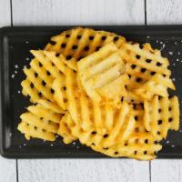 Waffle Fries · Waffle fries served with a sprinkling of salt.