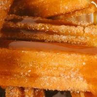 Caramel Churro · This churro is filled with caramel and rolled in cinnamon and sugar! You'll love it!