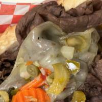Italian Beef Sandwich · A sandwich composed of thin slices of seasoned roasted beef, simmered and served au jus on a...