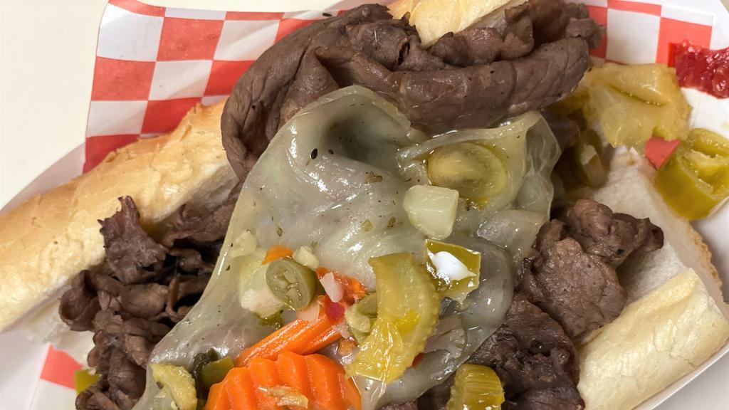 Italian Beef Sandwich · A sandwich composed of thin slices of seasoned roasted beef, simmered and served au jus on a long French Roll.