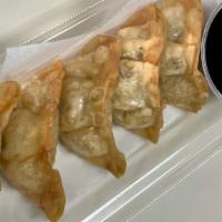 Mandu · Potstickers with pork & vegetables. Comes with a side of dipping sauce.