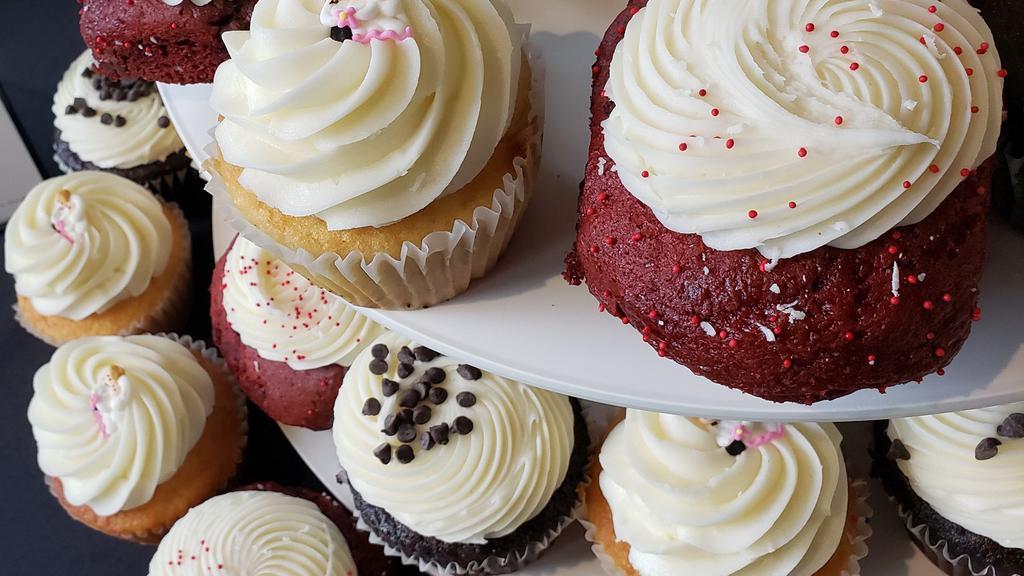 Surprise! Baker'S Choice Dozen · 12 of our GIANT sized cupcakes in a baker's choice assortment. Our jumbo cupcake is 2 times the standard cupcake size!