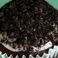Jumbo Giant Cookies 'N Cream Cupcake · GIANT Chocolatey cake filled with vanilla cream and topped with vanilla buttercream rolled i...