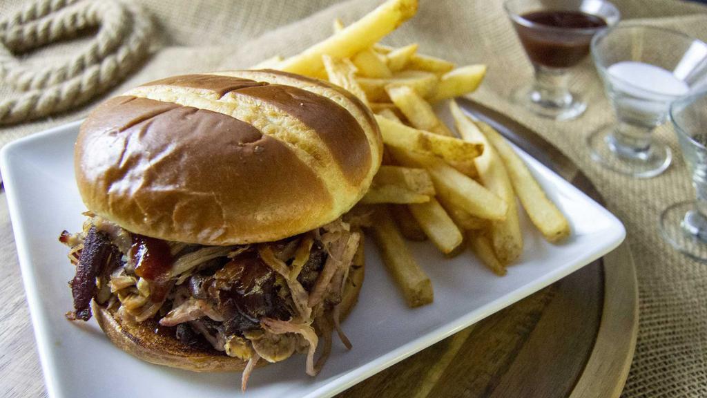 Pulled Pork Sandwich W/1 Side · Pulled Pork Sandwich, topped with BBQ Sauce w/Fries, choice of Texas Toast or Brioche Bun