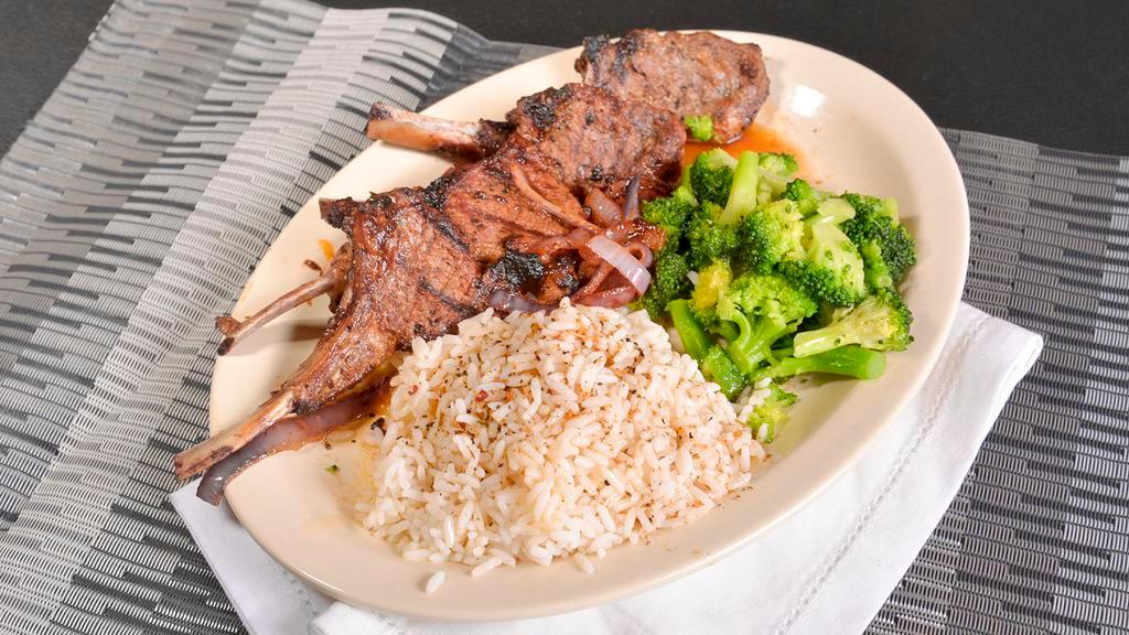 Lamb Chops · Four chops marinated and flame grilled.