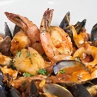 Linguine Frutti Di Mare · Imported pasta  with shrimp, calamari, scallops,  clams, and mussels in a spicy plum tomato ...