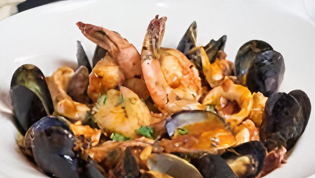 Linguine Frutti Di Mare · Imported pasta  with shrimp, calamari, scallops,  clams, and mussels in a spicy plum tomato sauce or garlic white wine.