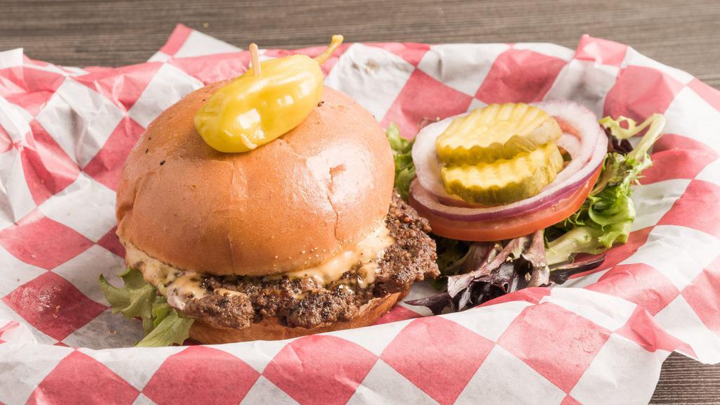 Burgerburger · 50/50 blend of ground beef and brisket, seasoned and broiled to perfection, topped with aged Cheddar, spring mix, tomato, onion, pickle, and drip sauce on a brioche bun.