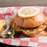The Og Tilapia Fish Sandwich · Tilapia fillets tossed in our special blend of seasonings & fried to perfection. Served on a...