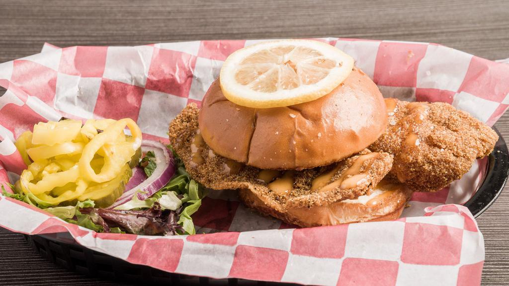 The Og Tilapia Fish Sandwich · Tilapia fillets tossed in our special blend of seasonings & fried to perfection. Served on a toasted hoagie with banana peppers and your choice of our house tartar or drip sauce.