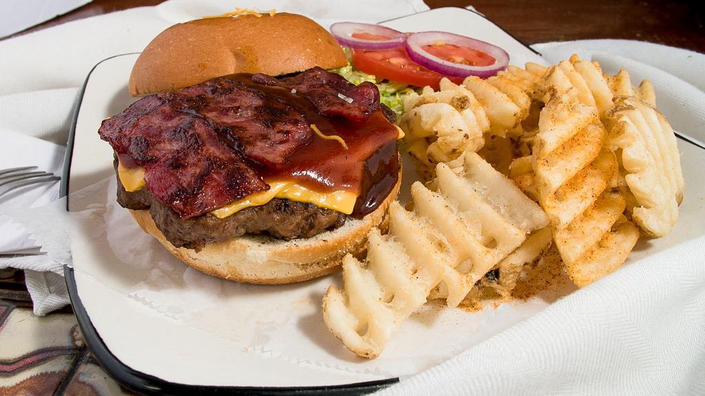 Cheddar Bacon Burger · Our 1/2 lb. hamburger covered in smokey bacon and shredded cheddar cheese served with lettuce, tomato, onion, ketchup, mayonnaise, and mustard on the side. Served with waffle fries, onion rings, side salad, cheese fries or seasoned curly fries.