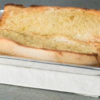 Garlic Bread · French bread brushed in garlic butter. Toasted to perfection. (a double portion of our garli...