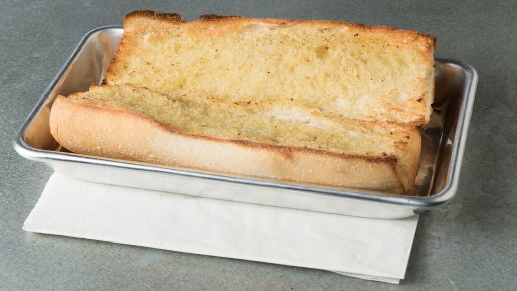 Garlic Bread · French bread brushed in garlic butter. Toasted to perfection. (a double portion of our garlic bread).