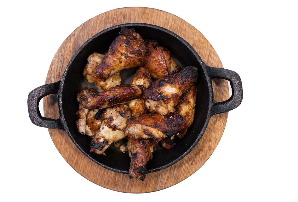 Chicken Wings · Oven baked chicken wings. Your choice of plain, buffalo, Bbq or honey sriracha. Served with ranch.