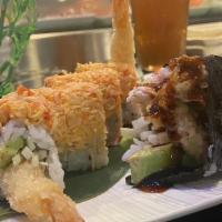 Firecracker Roll · Inside: shrimp tempura, cucumber, and avocado. Outside: spicy crab salad.