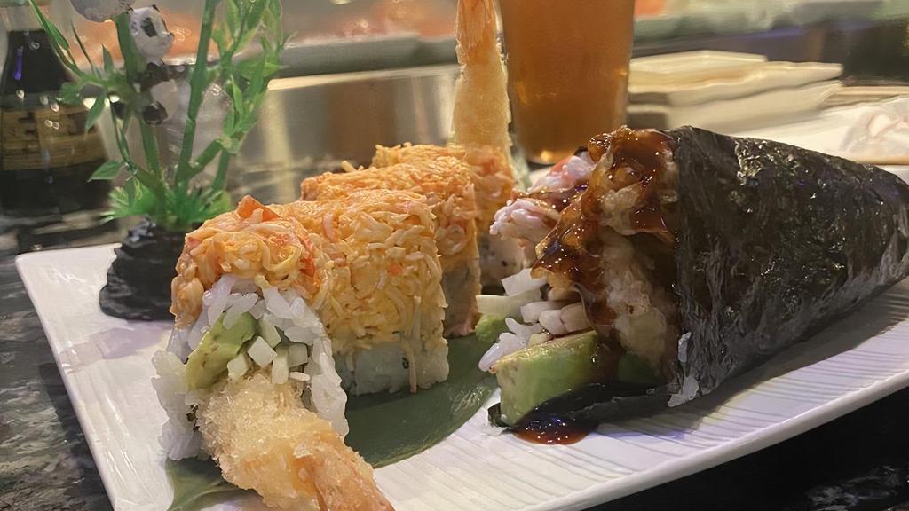Firecracker Roll · Inside: shrimp tempura, cucumber, and avocado. Outside: spicy crab salad.