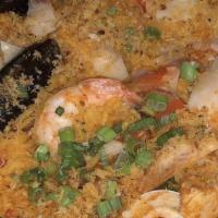 Seafood Paella · Gluten free. Saffron infused rice, calamari, mussels, shrimp, clams, tilapia, green onions, ...