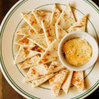 Artichoke Dip · Artichoke hearts, cream cheese, parmesan, and pita bread.