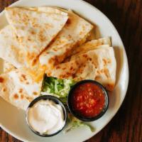 Quesadilla · Giant flour tortillas, shredded cheddar jack, with a side of salsa, and sour cream
