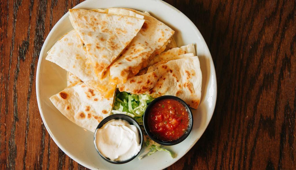 Quesadilla · Giant flour tortillas, shredded cheddar jack, with a side of salsa, and sour cream