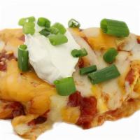 South Of The Border · Chorizo sausage, green chilies, onions, salsa, and cheese, garnished with sour cream, and ch...