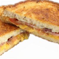 Ultimate Bacon Grilled Cheese · Premium bacon grilled with our combo cheese and tomato.