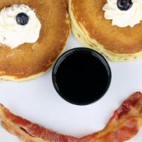 Smiley Face Pancake · Two pancakes with whipped cream 
