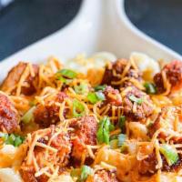 Buffalo Mac And Cheese · Cruspy Chicken tossed in Hoemade Buffalo Sauce, served over creamy Mac & Cheese.