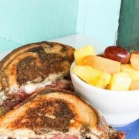 Reuben · HOEmade corned beef on grilled rye topped with melted swiss, sauerkraut and HOEisland.