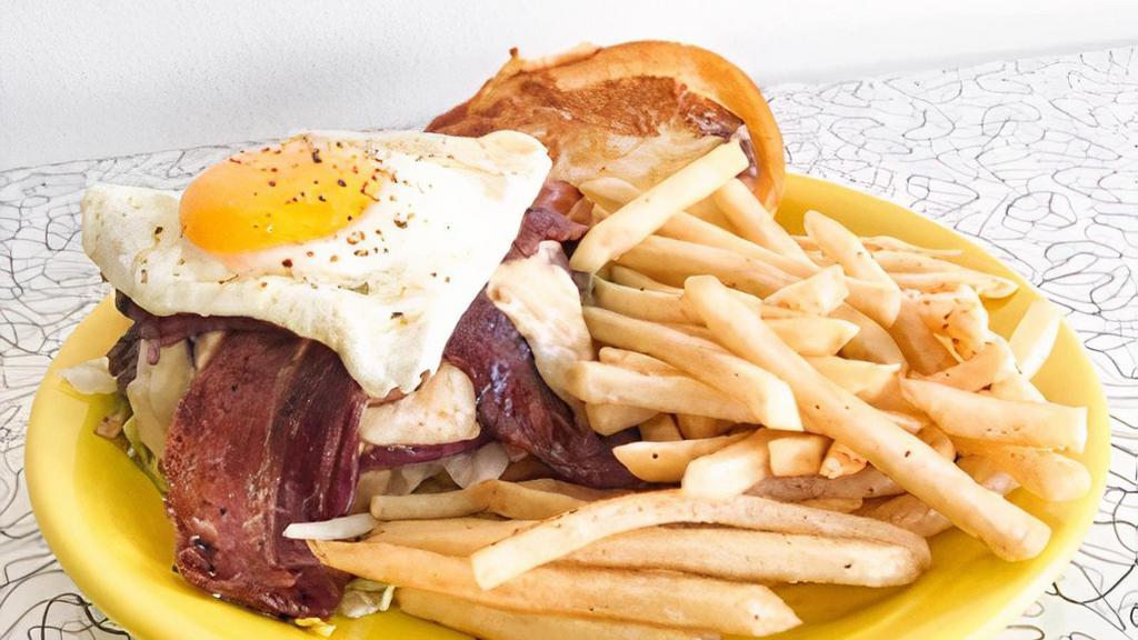 Hoe Burger · Fresh ground beef grilled and topped with red onion jam, swiss cheese spread, bacon aoli and a sunny side egg. Served on a toasted potato roll with lettuce and tomato.