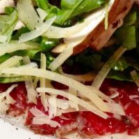 Beef Carpaccio · Thinly sliced pepper crusted beef tenderloin with arugula truffle cremini mushroom capers an...