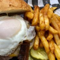 The Hangover · Colby-jack cheese, bacon, grilled onions and topped with an over easy egg.