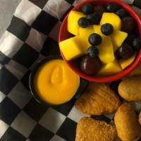 Kids Basket · Three mini corn dogs and three mac and cheese bites.