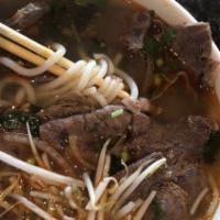 Spicy Hue Style Rice Noodle · Rice noodle, beef shank, eye round steak, pork meat loaf, lemongrass, green onion, cilantro.