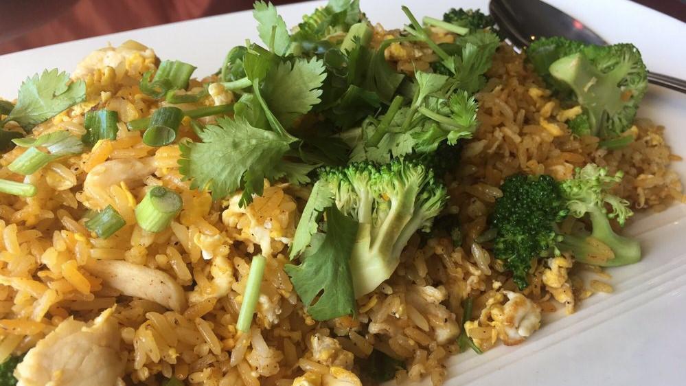 Chicken Cajun Fried Rice · Fried rice, eggs, green onions, and Cajun chicken.
