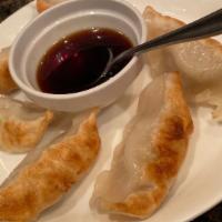 Beijing Pot Stickers (6) · Pan-fried or steamed dumplings, filled with vegetables and pork.