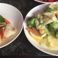 Ginger Lemon Fish Stir-Fried · Fish fillet with scallions and mixed vegetables in a ginger lemon white wine sauce.