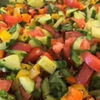Jerusalem Salad · Chopped parsley, tomato, cucumber, onion, mint, lemon, olive oil, and tahini.