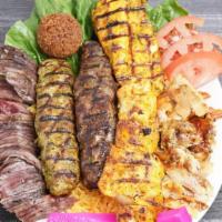 Meat Lover Zone Entree · A combination of falafel , beef kefta, chicken kefta, shish tawook, chicken shawarma, and be...