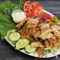 Shawarma Entree · Thin slices of fine roasted chicken or beef cooked on revolving rotisserie and marinated wit...