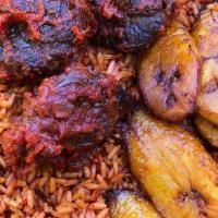 Jollof Rice · Steamed rice cooked in a tomato sauce with a unique blend, of spices. Served with fried plan...