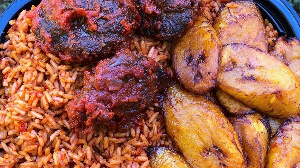 Jollof Rice · Steamed rice cooked in a tomato sauce with a unique blend, of spices. Served with fried plantains and choice of chicken, fish or  beef.