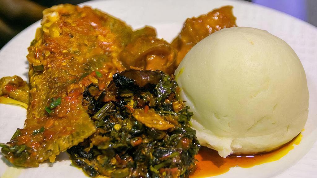 Assorted Greens & Spinach Vegetable Soup · Farm fresh combination of greens cooked down and blended with special spices and pieces of dried fish and dried shrimp from Africa. Served with fufu or rice.